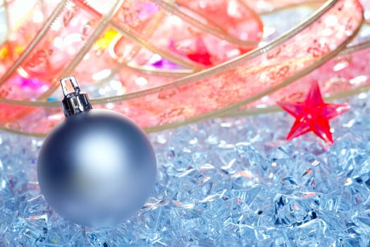 christmas baubles silver on winter ice with star symbol and ribbon