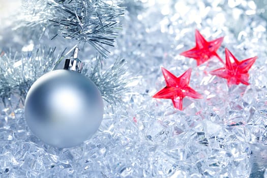 christmas baubles silver on winter ice with star symbol shapes