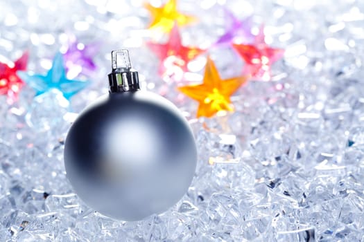 christmas baubles silver on winter ice with star symbol shapes