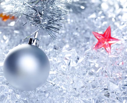 christmas baubles silver on winter ice with star symbol shapes
