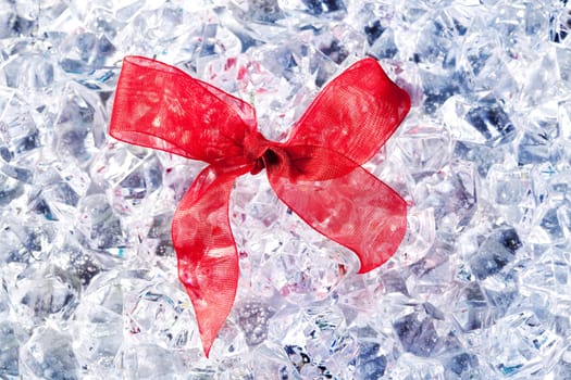 christmas gift ribbon loop on winter ice background