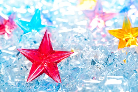 christmas red glass star on winter ice background