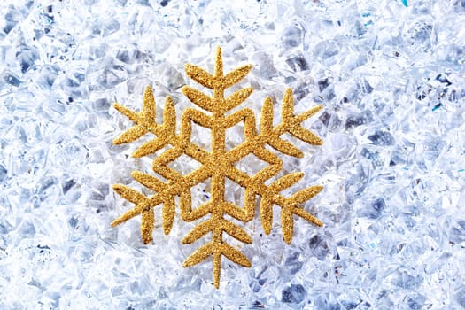 chritmas golden snowflake symbol on winter ice