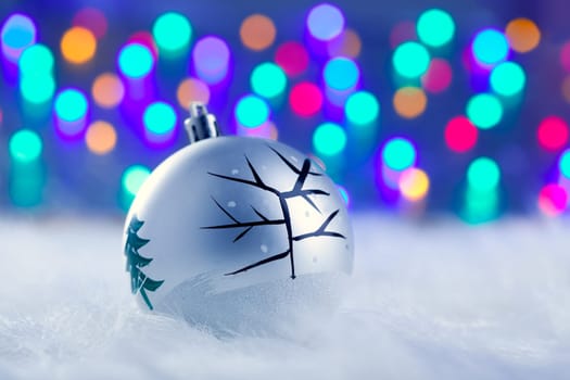 Christmas babule in silver with tree and colorful lights