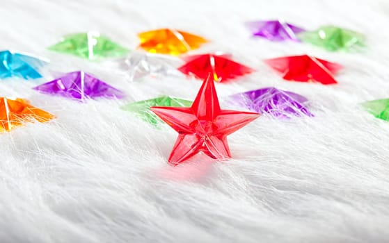 Christmas glass star over winter white fur background