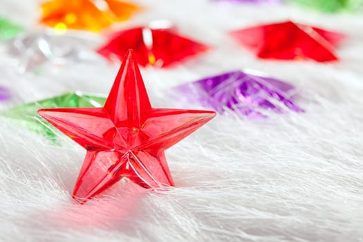 Christmas glass star over winter white fur background