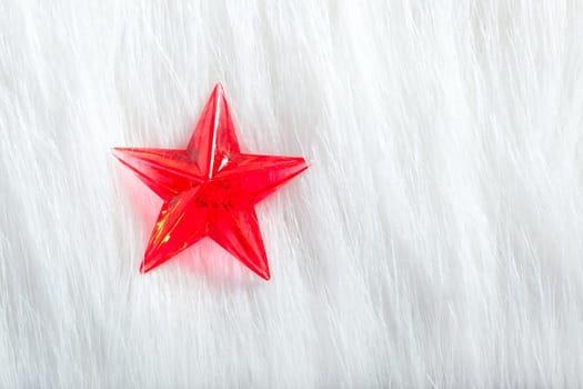 christmas red star over winter white fur background