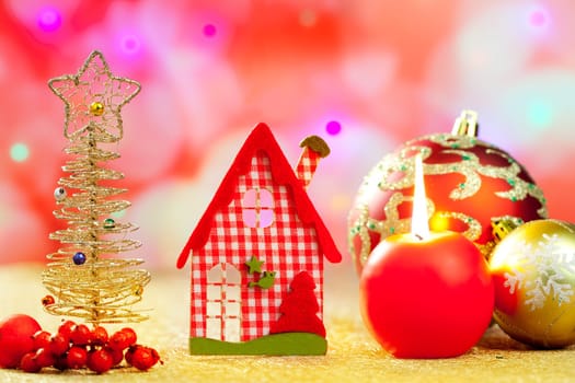 Christmas golden tree and red vichy house in blurred lights