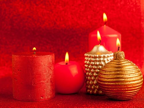 christmas candles group on red glitter background