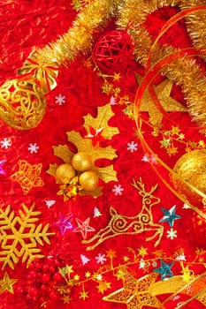 Christmas card background golden and red with baubles stars santa reindeer