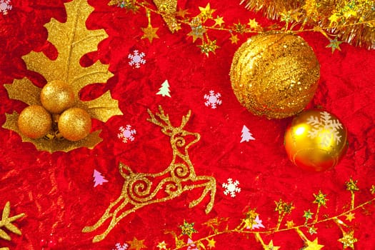 Christmas card background golden and red with baubles stars santa reindeer