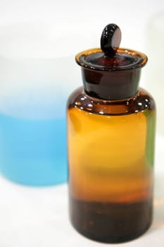 Laboratory stuff, glass cylinder vases, colorful liquids, chemical research