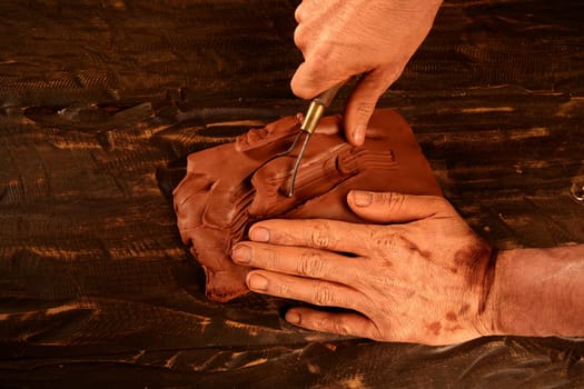pottery craftmanship potter craftman hands working red clay