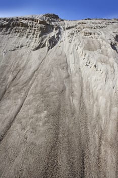 white sand quarry mound like moon mountain blue sky