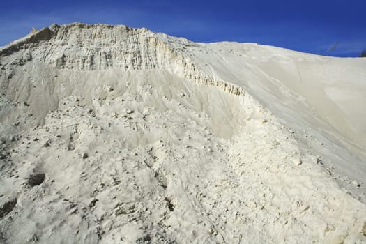 white sand mound quarry like a moon landscape