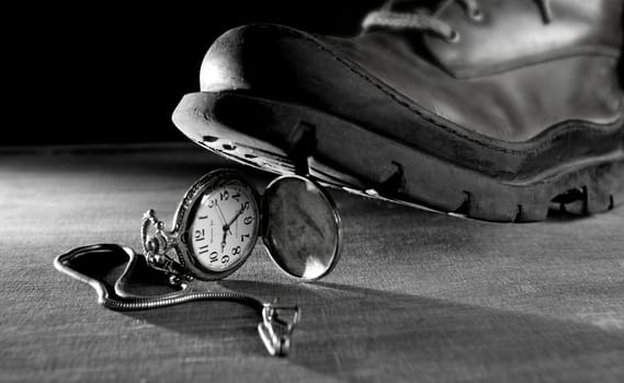 Stop the time metaphor. Old boot treading a vintage pocket watch