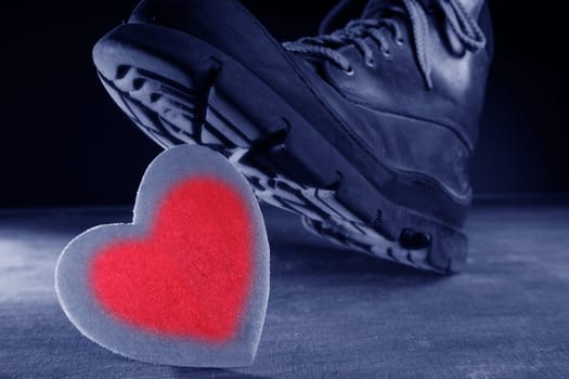 Kill the love or health metaphor. Boot treading a red valentines heart