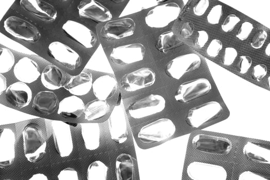 Background texture of pill tablets blister silver over white background