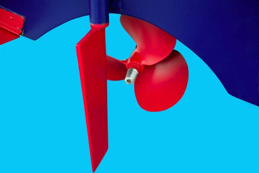 Boat red paint propeler helix in a blue hull boat isolated