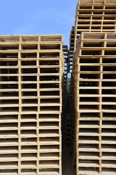 wooden pallets stacked blue sky industry storage transport
