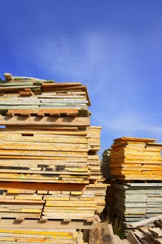 formwork shuttering wood board stacked blue sky