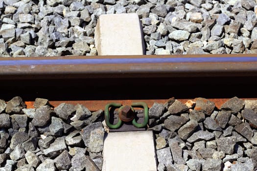 iron rusty train railway detail over dark stones rail way