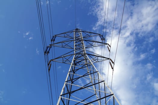 electric mast pole tower pilot on blue cloud sky cables
