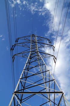 electric mast pole tower pilot on blue cloud sky cables