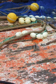 fishemen professional tackle net on boat aged grunge wooden wet deck