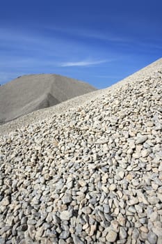 gravel gray mound quarry stock blue sky rolling stones