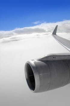 airplane wing aircraft turbine flying blue sky white clouds