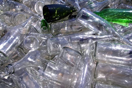 ecological recycling glass bottles in messy container