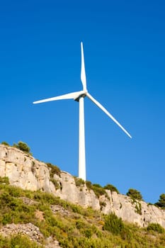 aerogenerator windmill in rocky mountain peak
