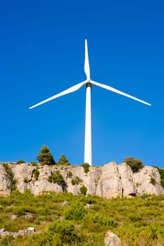 aerogenerator windmill in rocky mountain peak