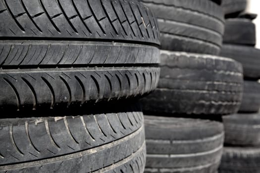 car tires used  pneus stacked in rows for recycle
