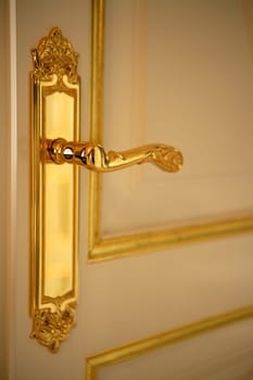 Golden door handle lock, white and gold door