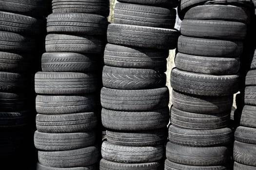car tires used  pneus stacked in rows for recycle