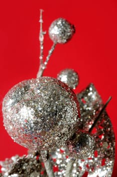 Christmas decoration detail over red studio background