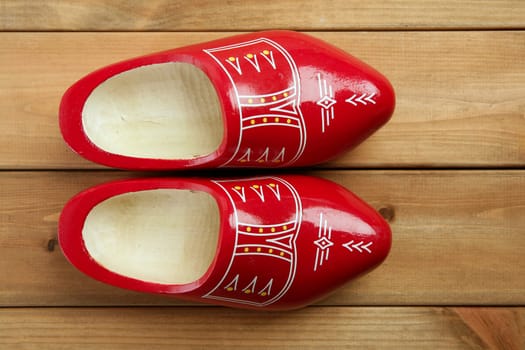 Dutch Holland red wooden shoes on wood background