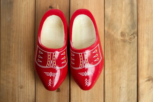 Dutch Holland red wooden shoes on wood background
