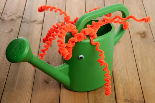 Different handmade garden can toy face and funny red hair