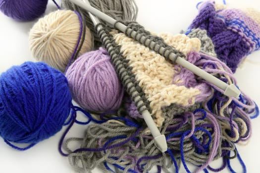 colorful knitting tools with wool thread balls