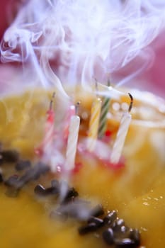 Blowed birthday cake candles with smoke cloud