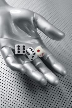 Dices gambling futuristic metaphor in silver aluminum hand