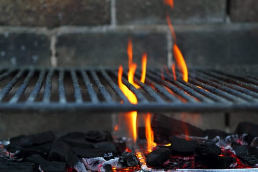 Bar b cue barbecue fire BBQ coal fire iron grill brick wall