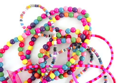 Colorful wood fashion necklaces mess over white background
