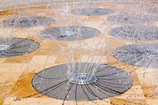 water spring source from stainless steel circles