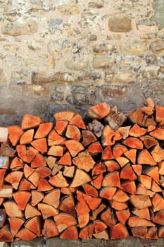 firewood wood pile stacked triangle shape red color