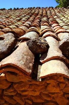 clay roof tiles old aged arabic style in Spain perspective