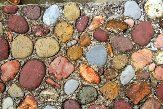 Rolling stones floor colorful pattern in Pyrenees Spain